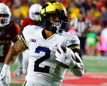 Michigan RB Corum vows to be back by fall camp