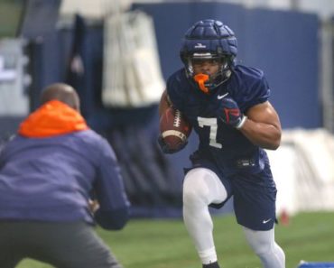 Shooting survivor Hollins back at UVA practice